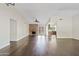 Spacious living room with hardwood floors, brick fireplace and doors to the patio at 13816 N 46Th St, Phoenix, AZ 85032