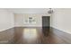 Inviting living room features neutral walls, wood floors and stylish light fixture at 13816 N 46Th St, Phoenix, AZ 85032