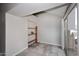 Bright dining area with a sliding glass door, tile flooring, and custom wooden shelving at 14002 N 49Th Ave # 1040, Glendale, AZ 85306