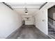Spacious garage with ample room for parking, storage, and access to interior stairs, ideal for organization at 14002 N 49Th Ave # 1040, Glendale, AZ 85306