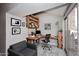 Home office featuring built-in shelving, a comfortable seating area, and a sliding glass door providing natural light at 14002 N 49Th Ave # 1040, Glendale, AZ 85306