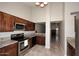 Well-equipped kitchen features stainless steel appliances, granite countertops, and ample cabinet space for storage at 14002 N 49Th Ave # 1040, Glendale, AZ 85306