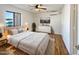 Bright bedroom with a ceiling fan, large window, and light wood flooring at 1440 N Idaho Rd # 1048, Apache Junction, AZ 85119