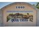 Quail Creek community sign with desert themed art of cactus and quail at 1440 at 1440 N Idaho Rd # 1048, Apache Junction, AZ 85119
