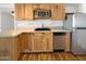 Well-appointed kitchen featuring ample wood cabinetry, granite countertops, and stainless steel appliances for modern living at 1440 N Idaho Rd # 1048, Apache Junction, AZ 85119