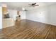 Bright living space featuring wood-style flooring, an open layout, and a view into the kitchen area at 1440 N Idaho Rd # 1048, Apache Junction, AZ 85119