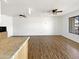 A spacious living room featuring wood-style floors, lots of light, and ceiling fans at 1440 N Idaho Rd # 1048, Apache Junction, AZ 85119