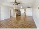 Bright living space featuring wood-style flooring, an open layout, and a ceiling fan for comfortable living at 1440 N Idaho Rd # 1048, Apache Junction, AZ 85119