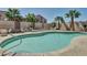 Enjoy the large community swimming pool with ample seating and nearby palm trees at 1440 N Idaho Rd # 1048, Apache Junction, AZ 85119