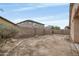 A large backyard with dirt area and a block wall at 15339 W Jefferson St, Goodyear, AZ 85338