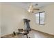 Bonus room featuring tiled floor, ceiling fan, and workout equipment at 15339 W Jefferson St, Goodyear, AZ 85338