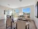 Inviting open-concept living and dining area with stylish seating, lots of light, and backyard views at 18052 W Sand Hills Rd, Surprise, AZ 85387