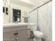 Bathroom featuring a tub-shower combo and large mirror over the vanity at 19202 N 14Th St, Phoenix, AZ 85024