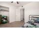 Bedroom with closet space, natural light, and an adjacent doorway at 19202 N 14Th St, Phoenix, AZ 85024