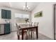 Dining area view showcasing neutral decor, chandelier and modern updates at 19202 N 14Th St, Phoenix, AZ 85024