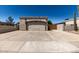 Exterior view featuring a two-car garage, desert landscaping and wide driveway with a private front yard at 19202 N 14Th St, Phoenix, AZ 85024