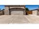 Exterior shot featuring a two-car garage, desert landscaping and wide driveway at 19202 N 14Th St, Phoenix, AZ 85024