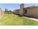 Well-maintained front yard with lush green grass, desert landscaping, and a charming facade at 19202 N 14Th St, Phoenix, AZ 85024
