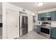 Stylish kitchen features stainless steel appliances, granite counters, and custom cabinetry at 19202 N 14Th St, Phoenix, AZ 85024