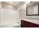 Well-lit bathroom featuring a shower-tub combo and granite vanity at 1968 E Emily Ln, Gilbert, AZ 85295