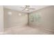 Bright, spacious bedroom with ample natural light from large windows and a ceiling fan at 1968 E Emily Ln, Gilbert, AZ 85295