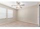 This bedroom has a ceiling fan and window, perfect for relaxing at 1968 E Emily Ln, Gilbert, AZ 85295