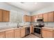 Efficient kitchen featuring stainless steel appliances and plenty of countertop space at 1968 E Emily Ln, Gilbert, AZ 85295
