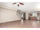 Open-concept living space with tile floors flowing into the kitchen and staircase at 1968 E Emily Ln, Gilbert, AZ 85295