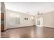 Spacious living room featuring neutral paint, tile flooring, and abundant natural light at 1968 E Emily Ln, Gilbert, AZ 85295