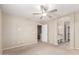 Large main bedroom featuring a ceiling fan and an en-suite bathroom at 1968 E Emily Ln, Gilbert, AZ 85295