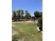 Neighborhood playground featuring a slide and shade trees, with houses in the background at 1968 E Emily Ln, Gilbert, AZ 85295