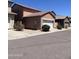 Street view of homes with desert landscaping, tile roofs, and attached garages at 1968 E Emily Ln, Gilbert, AZ 85295