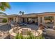 Extensive backyard patio with multiple seating areas, creating an inviting space for outdoor gatherings at 19714 N Rim Dr, Surprise, AZ 85374
