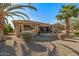 Beautiful backyard with desert landscaping, an expansive patio, and plenty of room for outdoor enjoyment at 19714 N Rim Dr, Surprise, AZ 85374