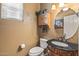 Charming half-bath featuring granite counters, wooden cabinetry, and decorative accents at 19714 N Rim Dr, Surprise, AZ 85374