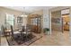 Inviting dining room with tile flooring, elegant chandelier, and stylish china cabinet for formal gatherings at 19714 N Rim Dr, Surprise, AZ 85374