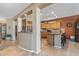 Spacious kitchen with tile floors, stone countertops, and natural wood cabinets at 19714 N Rim Dr, Surprise, AZ 85374