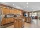 Spacious kitchen features stainless appliances, granite countertops, island, and breakfast area at 19714 N Rim Dr, Surprise, AZ 85374