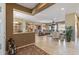 Spacious living area with tile flooring, neutral tones, and seamless transition into the kitchen and outdoor space at 19714 N Rim Dr, Surprise, AZ 85374