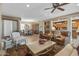 Spacious living area with tile flooring, neutral tones, and seamless transition into the dining and kitchen areas at 19714 N Rim Dr, Surprise, AZ 85374