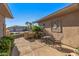 Picturesque courtyard with comfortable seating, decorative wall art, and lush landscaping offering a private outdoor space at 19714 N Rim Dr, Surprise, AZ 85374