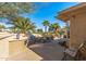 Expansive outdoor patio with a built-in BBQ area, dining set, and views of a golf course at 19714 N Rim Dr, Surprise, AZ 85374
