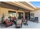 Covered patio featuring ample seating, perfect for relaxing and enjoying the outdoor ambiance at 19714 N Rim Dr, Surprise, AZ 85374