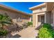 Cozy courtyard featuring outdoor seating, elegant wall art, and beautiful landscaping creates a relaxing atmosphere at 19714 N Rim Dr, Surprise, AZ 85374