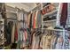 Organized walk-in closet with clothes hanging and shelving at 19714 N Rim Dr, Surprise, AZ 85374