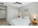 Neutral bedroom featuring a queen bed, ceiling fan, and closet with sliding doors at 20121 N 76Th St # 1019, Scottsdale, AZ 85255