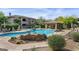 Community pool area with lounge chairs, a gazebo, and beautiful landscaping at 20121 N 76Th St # 1019, Scottsdale, AZ 85255