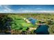 Aerial view of beautiful golf course with green grass, sand traps, and lakes at 20121 N 76Th St # 1019, Scottsdale, AZ 85255