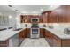 Updated kitchen showcasing stainless steel appliances, granite countertops, and ample cabinet space at 20121 N 76Th St # 1019, Scottsdale, AZ 85255