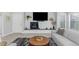 Cozy living room features a modern fireplace, sleek shelving, and plantation shutters at 20121 N 76Th St # 1019, Scottsdale, AZ 85255